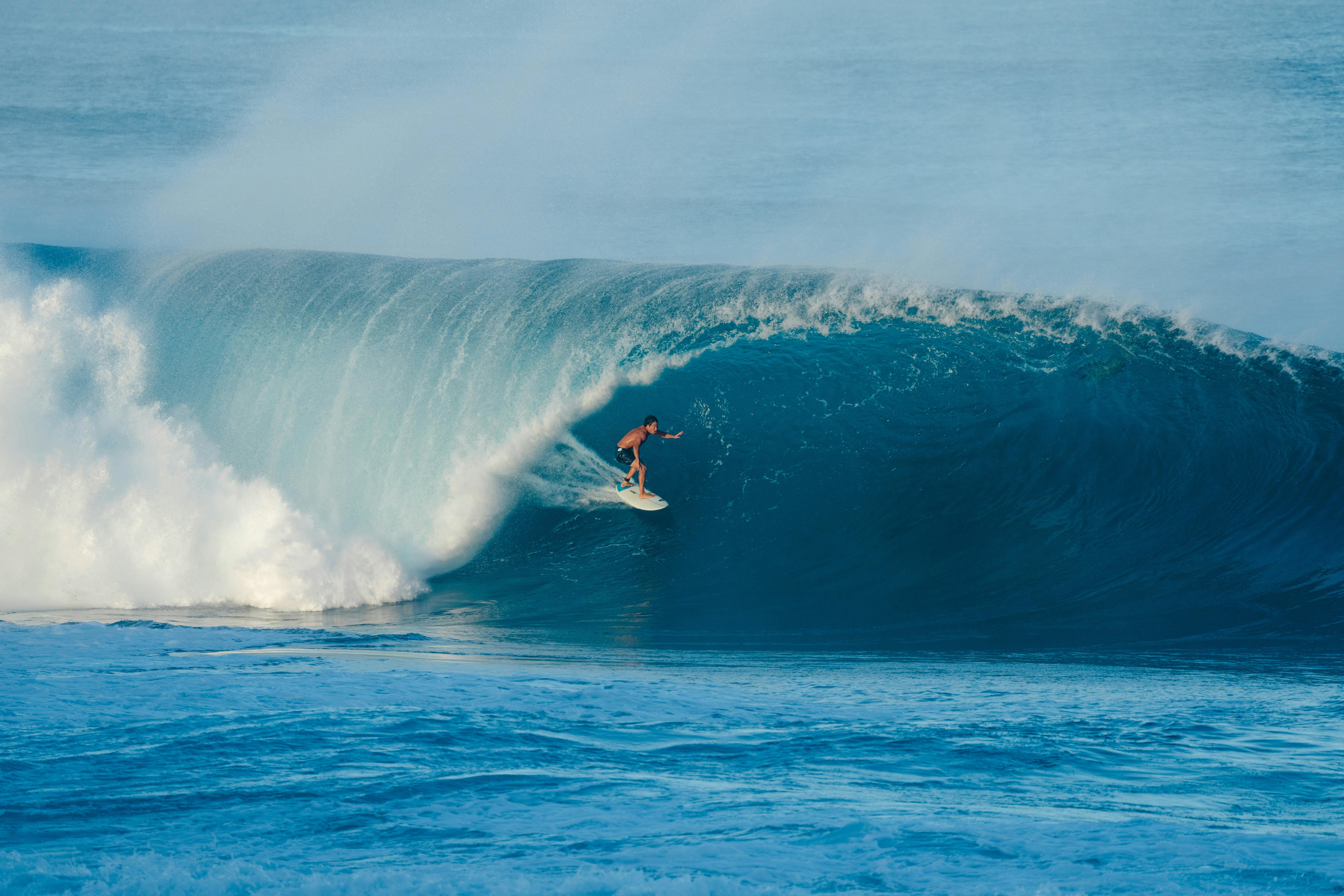 a surfer riding a surf wave
