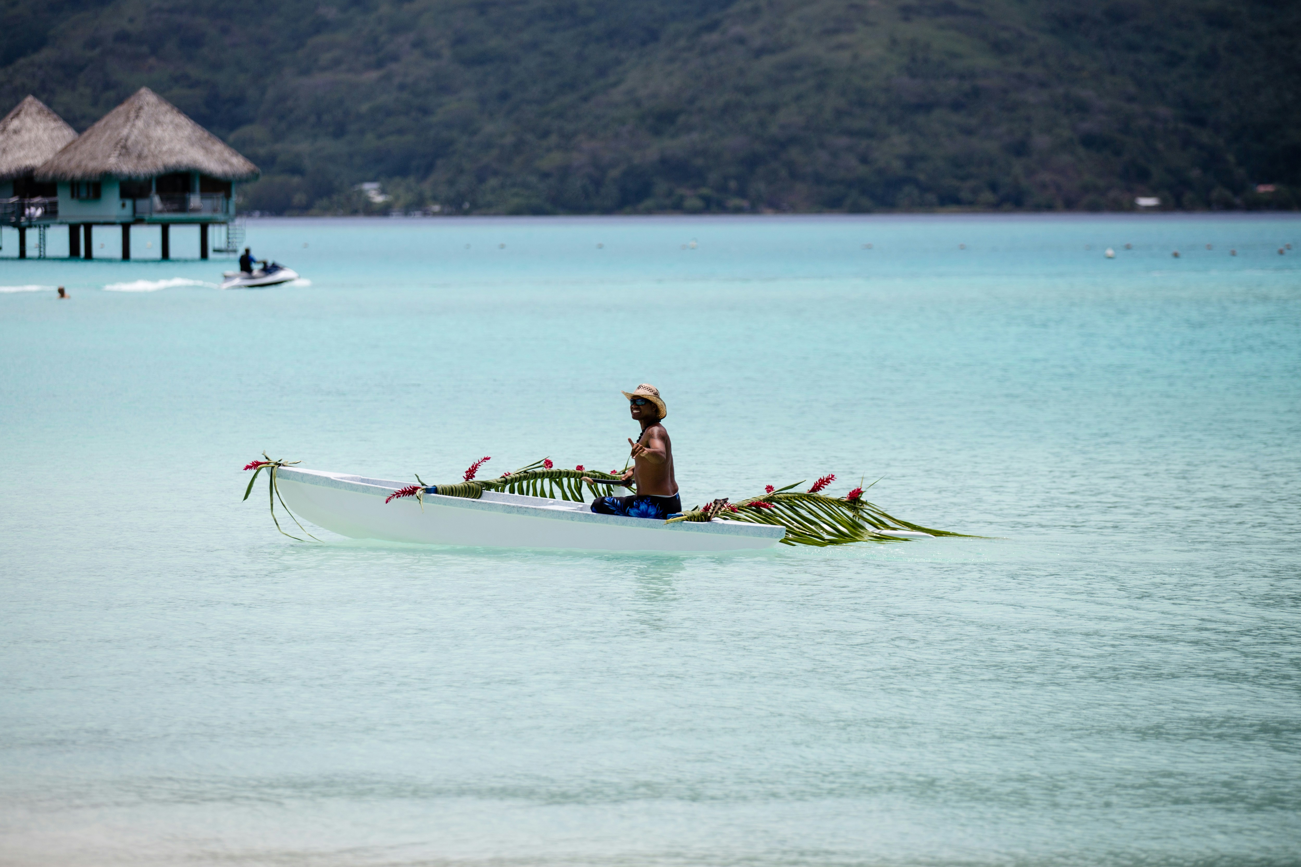 Man on a boat decorated for a Polynesian wedding